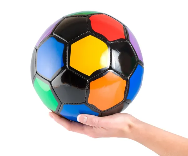 Soccer ball in hand — Stock Photo, Image