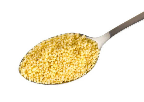 Millet in a spoon — Stock Photo, Image