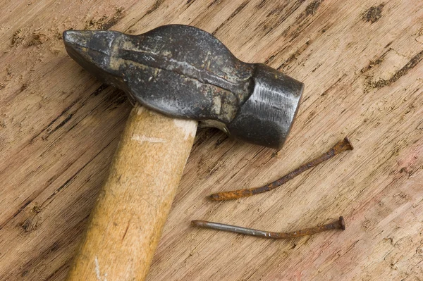 Hammer with a rusty nail — Stock Photo, Image