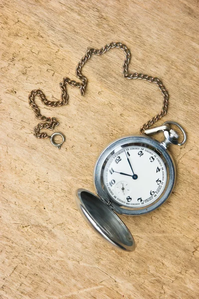 Pocket watch against the wooden planks — Stockfoto