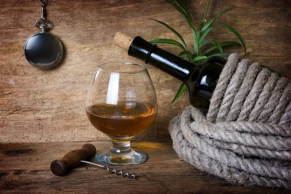 Bottle of wine wrapped with rope Royalty Free Stock Images
