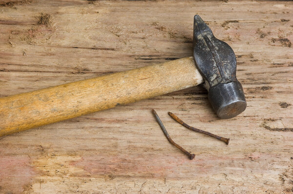 Hammer with a rusty nail