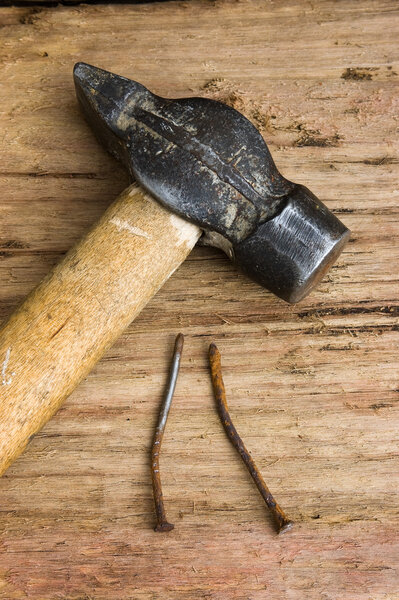 Hammer with a rusty nail