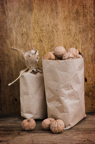 Nuts in paper bags — Stock Photo, Image