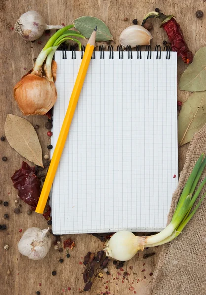 stock image Notebook for recipes on the background of spices