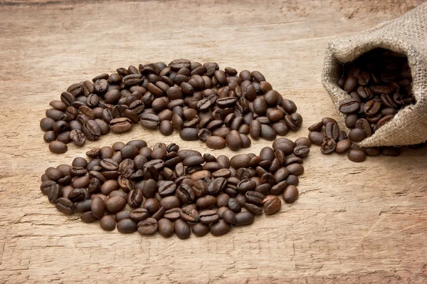 Coffee beans on the board — Stock Photo, Image