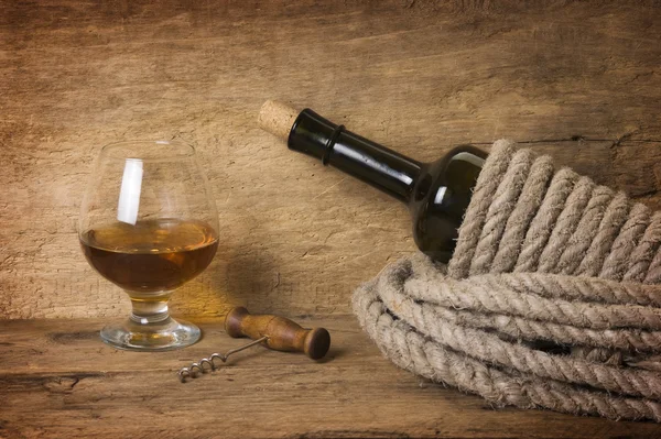 Bottle of wine wrapped with rope Stock Image