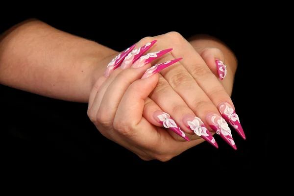 Mänskliga fingrar med lång nagel och vackra manikyr isolerade på svart — Stockfoto