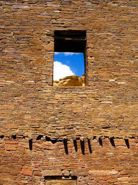 Ruin wall with window opening of sandstone bricks of pueblo bonito in chaco canyon, NM, USA, the center of sunken Anasazi Culture of ancestral native Americans.