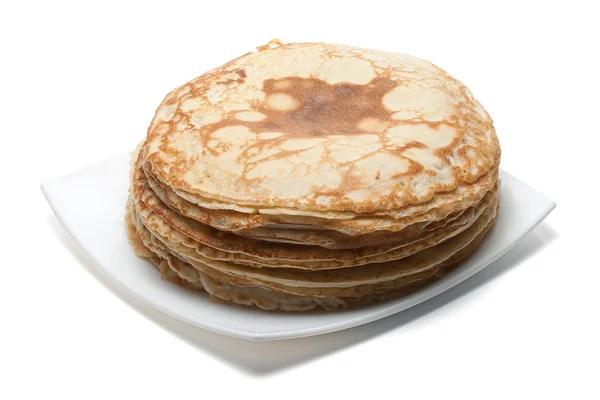 Heap of pancakes on white plate — Stock Photo, Image