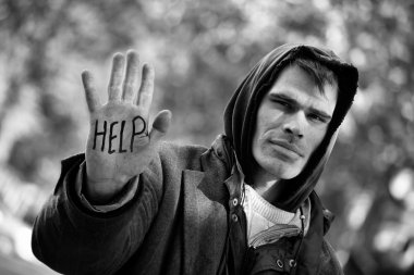 Young Homeless Men with hand outstretched: You can Help! clipart