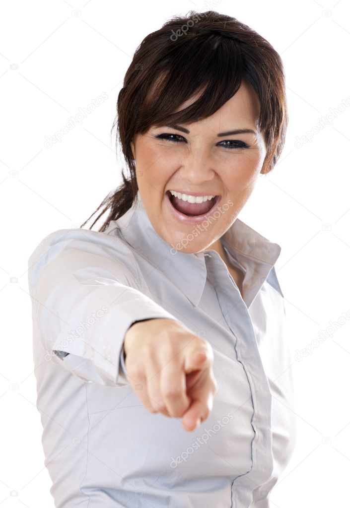 Young Woman pointing at viewer on white Background