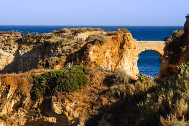 Algarve rock - coast in Portugal, brich in the evining clipart