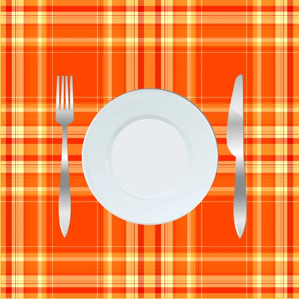 ディナー プレート、ナイフとフォーク オレンジ色のテーブル クロスの上 — ストック写真