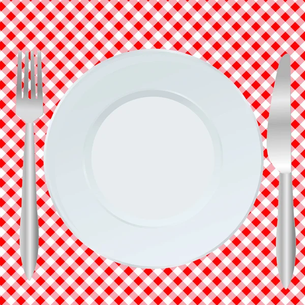 Placa, garfo e colher na toalha de mesa quadrada vermelha — Fotografia de Stock