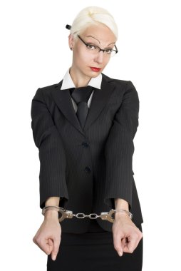 Young business woman with handcuffs on her hands. clipart