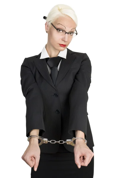 Young business woman with handcuffs on her hands. — Stock Photo, Image