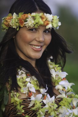 Portrait of a hawaiian hula dancer wearing flower lei clipart