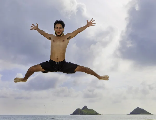 Asian man jumping in the air — Stock Photo, Image