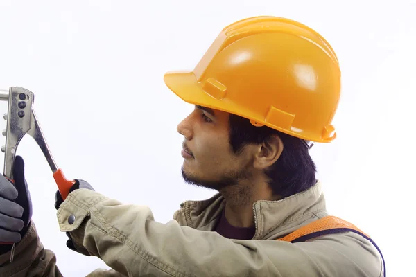 Trabalhador chapéu duro com uma ferramenta de rebite — Fotografia de Stock