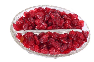 Dried cranberries in the glass bowl clipart