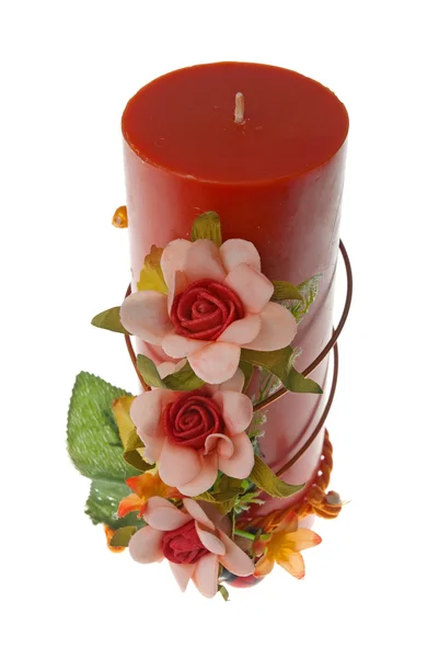Große rote Kerze mit Blumenschmuck — Stockfoto
