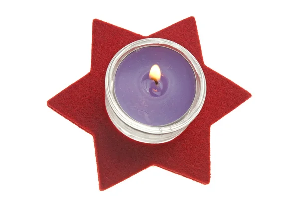 Красная звезда со свечой — стоковое фото