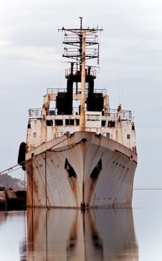 Rusty old ship waiting for dismantling. clipart