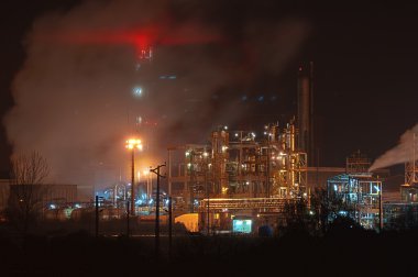 Industrial plant at dusk clipart