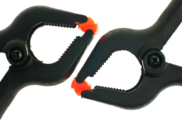 Red and black plastic clamps — Stock Photo, Image