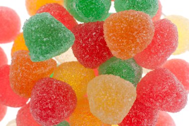 Macro up view of gelly sugar candy on white bright background. clipart