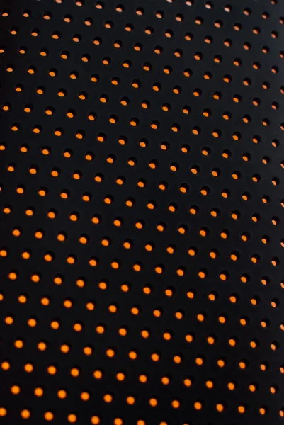 Svart Plast Mesh Textur Bakgrundsbelyst Med Orange Ljus — Stockfoto