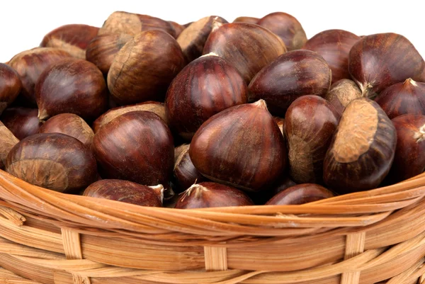 Wicker basket with chestnuts — Stock Photo, Image