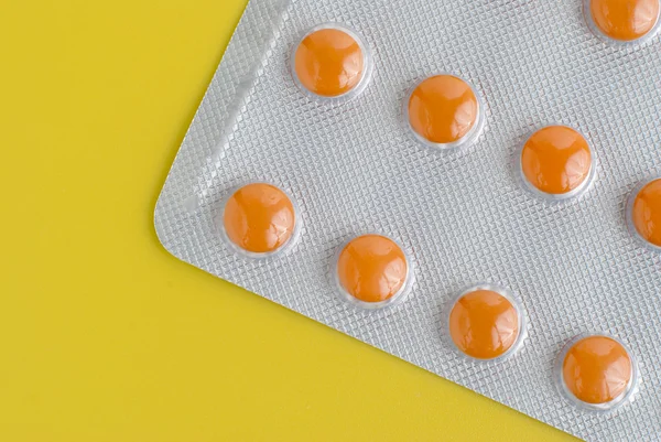 Pack orange piller — Stockfoto