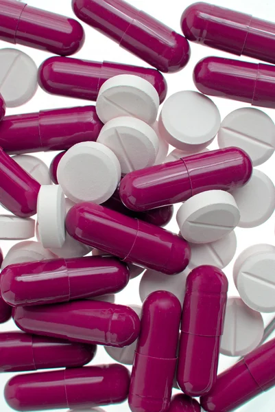Purple and white pills — Stock Photo, Image