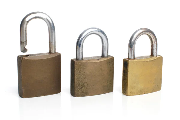 Três fechaduras de ouro segurança — Fotografia de Stock