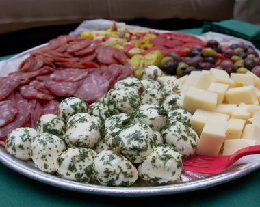 An image of a platter of Italian antipasto. clipart