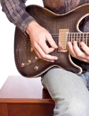 A guitarist playing his guitar clipart