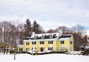 Yellow House Covered in Snow clipart