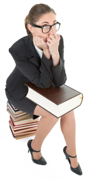 Vrouw en een stapel boeken — Stockfoto