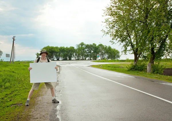 stock image Tourist on a country road