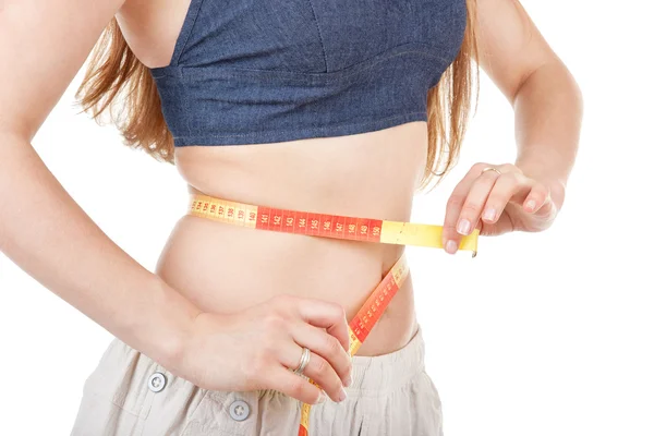 Girl measuring her waist — Stock Photo, Image