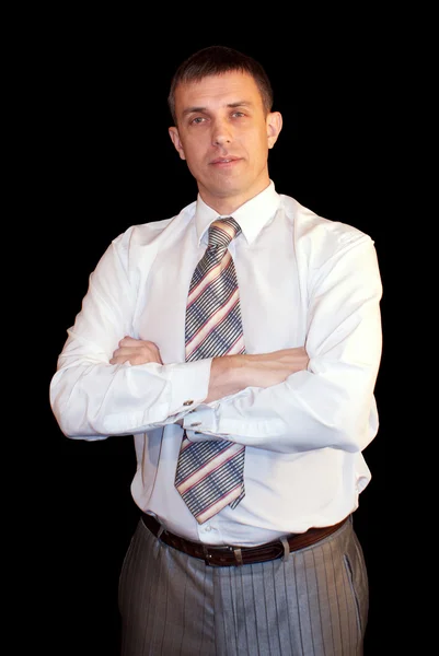 Portrait of the successful businessman on a black background — Stock Photo, Image