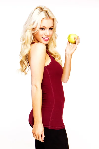 金发性感的女人微笑着新鲜的青苹果 — 图库照片