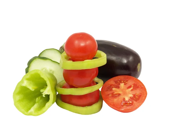 Tomato pyramid and fresh vegetables.Isolated. — Stock Photo, Image