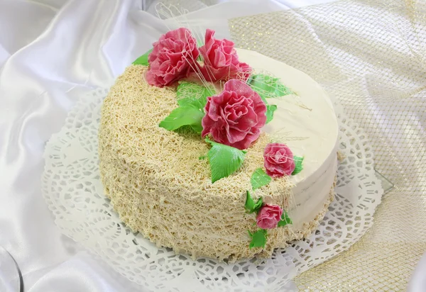 Cake decorated with flowers from cream