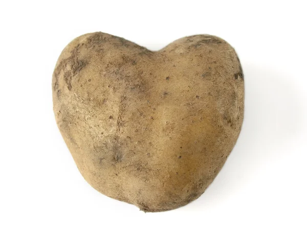 Patatas en forma de corazón sobre un fondo blanco —  Fotos de Stock
