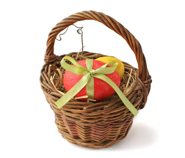Red Easter egg in a basket — Stock Photo, Image