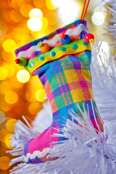Decorative boots on a white Christmas tree. — Stock Photo, Image