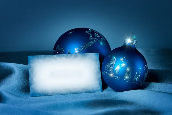 stock image Blue baubles on a silk with postcard